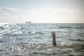 Single hand of drowning man in sea asking for help Royalty Free Stock Photo