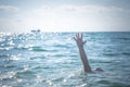 Single hand of drowning man in sea asking for help Royalty Free Stock Photo