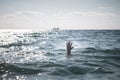 Single hand of drowning man in sea asking for help Royalty Free Stock Photo