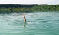 Single hand of drowning man in water asking for help