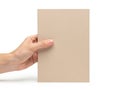A single hand holding a beige notebook against a white background Royalty Free Stock Photo