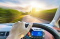 Single hand holding right steering wheel driving on motion road Royalty Free Stock Photo