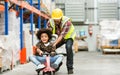 Single handsome father worker playing, riding bike together with his little son, happy smiling while taking break from working in