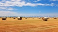 Single hay bale on expansive field