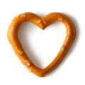 Single heart shaped salty pretzel snack isolated on white from a Royalty Free Stock Photo