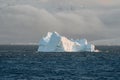 Single iceberg floating in water. Antarctica and Arctic Greenland. Global warming and climate change concept. Travel.