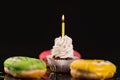 Single iced cupcake with birthday candle Royalty Free Stock Photo