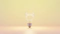Single incandescent light bulb glowing brightly with a soft yellow gradient background Royalty Free Stock Photo