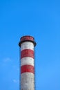 A single industrial chimney, blue sky Royalty Free Stock Photo