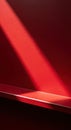 Dramatic red spotlight illuminating a smooth surface with shadows Royalty Free Stock Photo