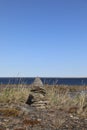 A single Inuit marker along an arctic coast