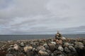 Single Inukshuk or Inuksuk along the arctic coast near Arviat