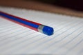 Single isolated pencil over a scribbling pad Royalty Free Stock Photo