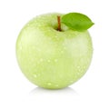 Single juicy green apple with leaves