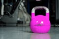 Single kettlebell on the gym floor ready to use for strength and conditioning training sport concept Royalty Free Stock Photo