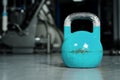 Single kettlebell on the gym floor ready to use for strength and conditioning training sport concept Royalty Free Stock Photo