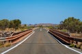 Single lane bridge interrupting two lane highway in Australian Outback Royalty Free Stock Photo
