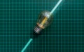 Single led filament light bulb on a green technical grid mat. Royalty Free Stock Photo