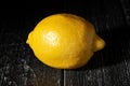 single lemon on wood