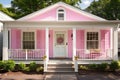 single-level colonial house with a pink central front door