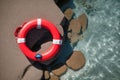 A single lifebuoy adrift on a sparkling summer sea