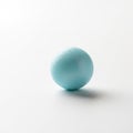 A single light blue spherical object is centered on a plain white background Royalty Free Stock Photo