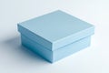 A single light blue square gift box on white Royalty Free Stock Photo