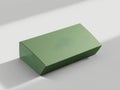 A single light green rectangular box sitting on a white surface with a soft shadow behind it Royalty Free Stock Photo