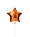 Single light orange color metallic star balloon object for birthday party isolated on a white Royalty Free Stock Photo