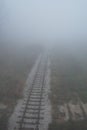 Old railway track disappears in fog