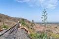 Single line railway track passing over bridge to enter a tunnel Royalty Free Stock Photo