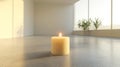 A Single Lit Candle on a Grey Floor in a Minimalist Room Royalty Free Stock Photo