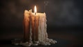 A single lit candle with a warm glowing flame sits on a dark surface Royalty Free Stock Photo