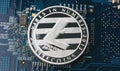 Cryptocurrency physical silver litecoin coin on motherboard