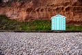 A single lone beach hut on the single of a Devon Beach