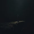 Single lonely person standing in darkness. Psychology and mental health concept