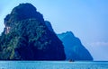 Long tail boat next to mountain of Phi Phi island, Thailand Royalty Free Stock Photo