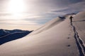 Single male backcountry skier climbing a snowy ridge near Klosters Royalty Free Stock Photo