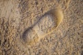 Single male footprint. Footprint from shoe or spade in sand. Background. Royalty Free Stock Photo