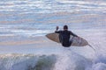 Single Male Surfer airborne over wave
