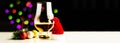 Single malt  whisky in tasting glass on christmas background, colorful bokeh Royalty Free Stock Photo