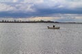 Gone fishing man on boat on draycote water reservoir in warwickshire Royalty Free Stock Photo
