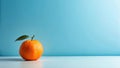 A single mandarin orange with a green leaf on a light blue background. Generative AI Royalty Free Stock Photo