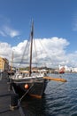 Single mast boat in the harbor Royalty Free Stock Photo