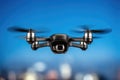 Single matte black quadcopter drone with four rotors and subtle silver motor housings Royalty Free Stock Photo