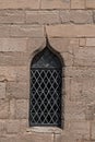 Single medieval castle stained glass window detail close up view