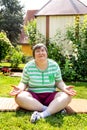 single mentally disabled woman is doing some relaxation yoga exercises