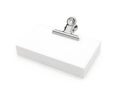Single metal clip securing a white paper Royalty Free Stock Photo