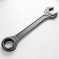 A Single Metal Combination Wrench with Open and Box Ends on a White Background spanner tool Royalty Free Stock Photo