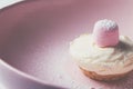 Single mini vanilla cheesecake with pink marshmellow